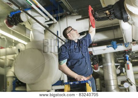 A good serviceman working on a machine room