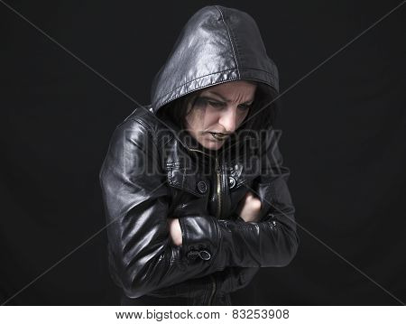 A gothic woman over a dark background,