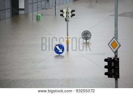 PRAGUE, CZECH REPUBLIC - JUNE 3, 2013: Flooded crossroad with traffic lights and a keep right traffic sign partially flooded by the swollen Vltava River in Prague, Czech Republic.