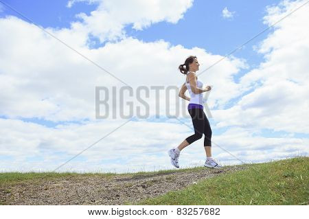 A woman sport in the field and playing sports