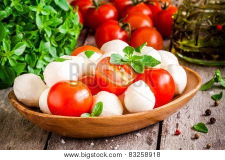 Mozzarella, Organic Cherry Tomatoes, Fresh Basil And Olive Oil