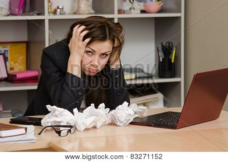 The Girl At The Computer Holding Head In His Hands