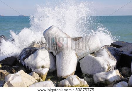 Frozen Tetrapod  And Waves In Winter Day