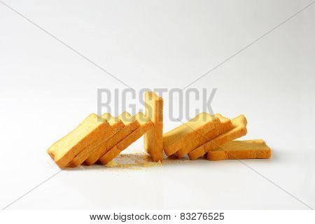 crispy rusks on white background
