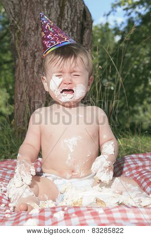 Baby girl celebrating her first bithday with gourmet cake