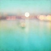 Abstract blurred cityscape background with bokeh effect. Grunge and retro style.