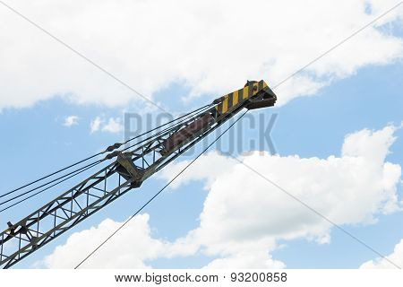 Old Crane Or Metal Structure And Sling On Blue Sky Background Side View