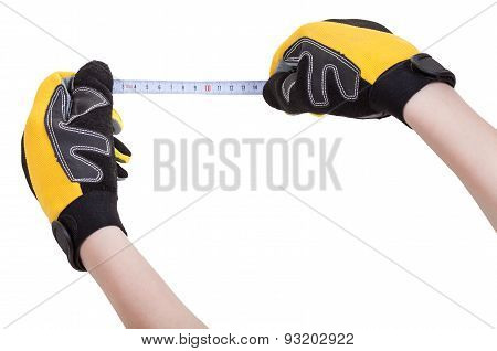 Hands In Protective Glowes With Measuring Tape