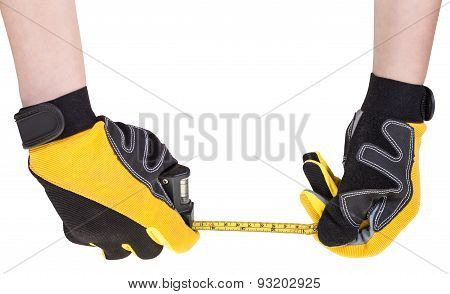 Worker Hands In Safety Glowes With Measuring Tape