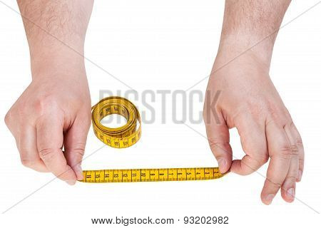Male Hands With Tailor Measuring Tape Isolated