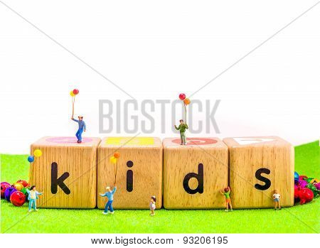 Image Of Mini Figure Kids Dolls Hold Balloon Playing On Toys Wooden  Blocks .