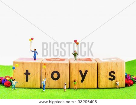 Image Of Mini Figure Kids Dolls Hold Balloon Playing On Toys Wooden  Blocks .