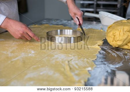 Pastry Chef Cutting Pie Dough