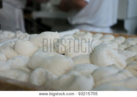 Raw Bread Dough In Front Of Bakers