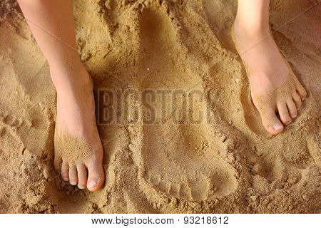 Kids Foot On The Beach Sand As A Therapy Against Patypodia