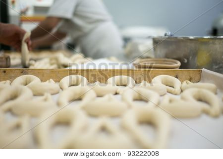 Bakers Preparing Fresh Pretzel Dough On Tray