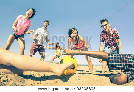 Group Of Multiracial Friends Playing Beach Soccer At Beginning Of Summer - Fun Concept