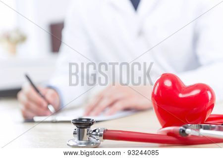 Nice doctor filling the papers
