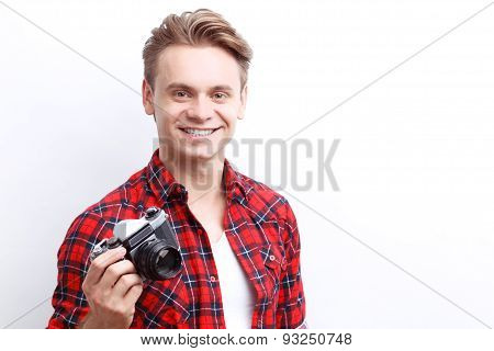 Vivacious guy holding camera