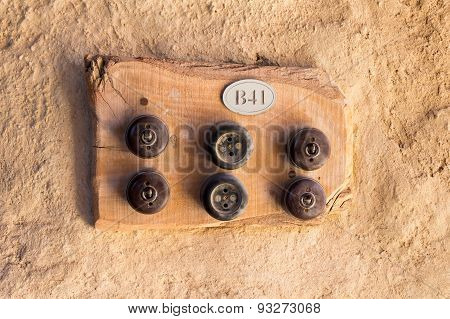 Two Old Sockets And Four Switches On ? Wooden Plate.