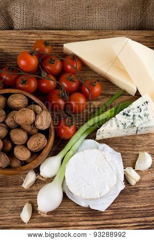 Top View On Several Kinds Of Cheese And Vegetable