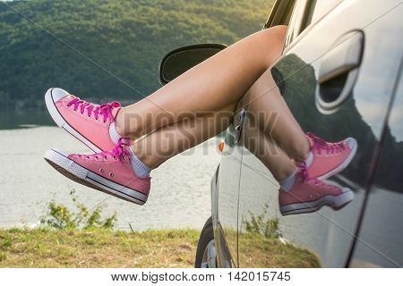 Legs Out Of The Car Window By The Lake