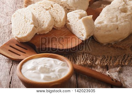 Sliced Boiled Knedle Close-up And Sour Cream. Horizontal