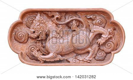 Wood carvings on the wall of Temple in Thailand; thai art style; Traditional Thai style wood carving on the wall of Temple in Thailand
