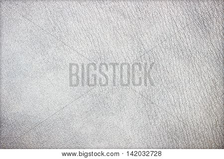 The abstract gray leather texture closeup background.