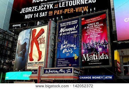 New York City - November 15 2015: Billboards advertising hit Broadway musicals Kinky Boots An American in Paris and Matilda in Times Square *