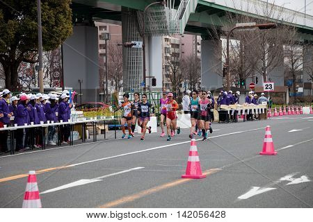 NAGOYA JAPAN - MARCH 13, 2016: Nagoya Women's Marathon 2016. Women's running in the downtown. Course Start and finish at Nagoya Dome Distance 42.195km. Nagoya city Japan.