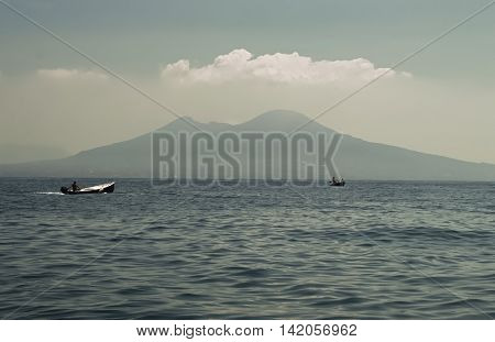 A sea view of Mount Vesuvius with boat