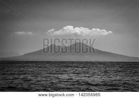 Retro vintage black and white sea view of Mount Vesuvius