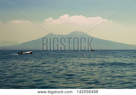 A sea view of Mount Vesuvius with boat