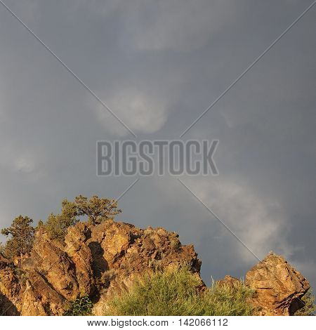 Storm light enhances the jagged details of some of  the cliffs of Central Oregon's beautiful geology.