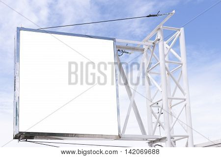 The advertisement board hanging on the building structure with blue sky