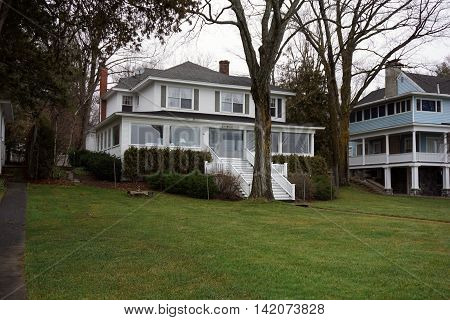 WEQUETONSING, MICHIGAN / UNITED STATES - DECEMBER 22, 2015: An elegant white home, christened Third Base, on Beach Drive in Wequetonsing.