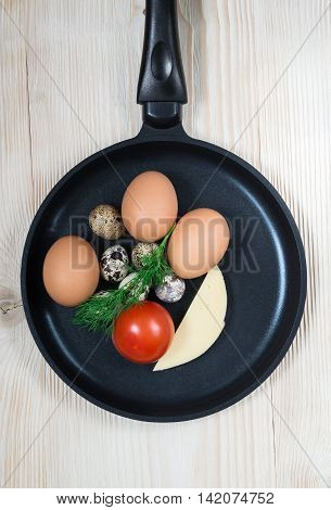 cheese tomatoes in a pan quail egg chicken