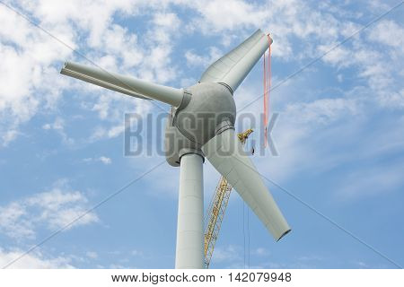 Assembling wings new Dutch windturbine with large crane