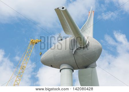 Assembling wings new Dutch windturbine with large crane