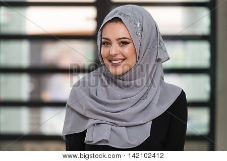Young Caucasian Woman Praying With Head Dress