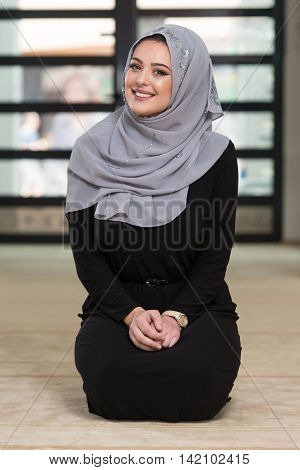 Woman Praying In The Mosque