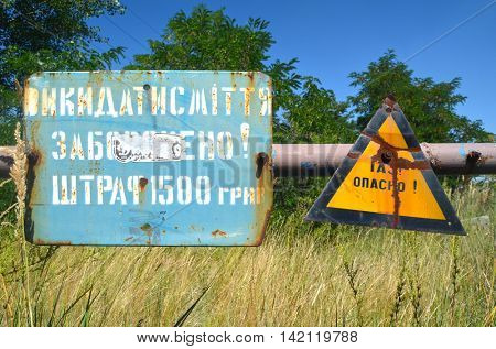 Gas -danger sign (RU). Ukrainian gas pump station entrance.August 5, 2016.Near Kiev,Ukraine