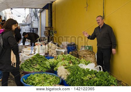 Istanbul Turkey - March 31 2013: Istanbul Balat. Inebolu (Kastamonu) district bazaar. When compared to other pazar (markets) Kastamonu can seem a little challenging. Like others this market sets up shop on a small street once a week every Sunday in Balat.