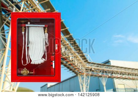 Fire safety equipment cabinet line industrial background.
