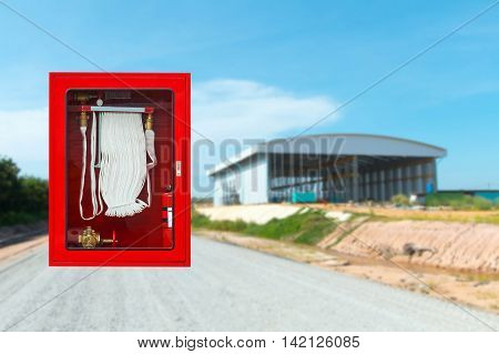 Fire safety equipment cabinet line industrial background.