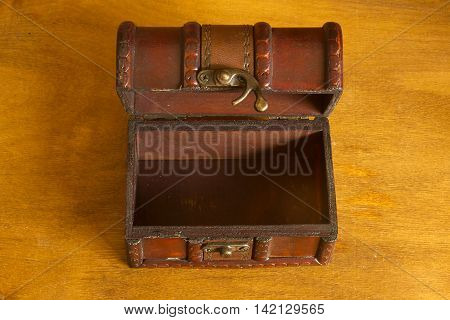 Old antique brown wood treasure chest or box