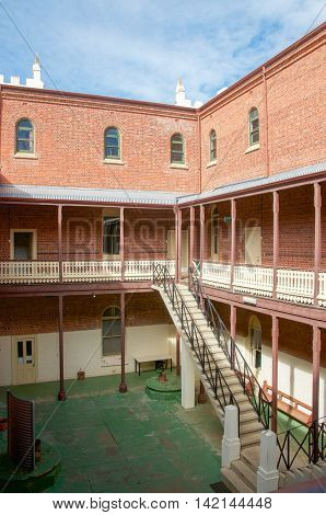 NEW NORCIA,WA,AUSTRALIA-JULY 15,2016: Exterior of the brick Spanish gothic St. Ildephonsus College for Boys in the historic monastic town of New Norcia, Western Australia.