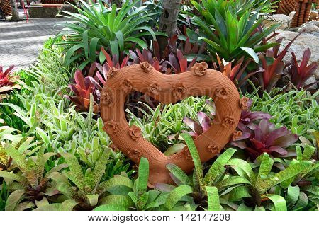 Heart made of clay displayed in the garden of Phuket, Thailand