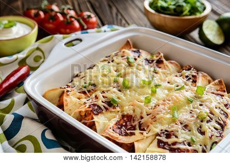 Chicken Enchiladas With Spicy Tomato Sauce, Corn, Beans And Cheese
